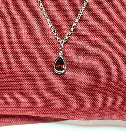 Pear shaped necklace set with a real red garnet stone sterling silver including chain