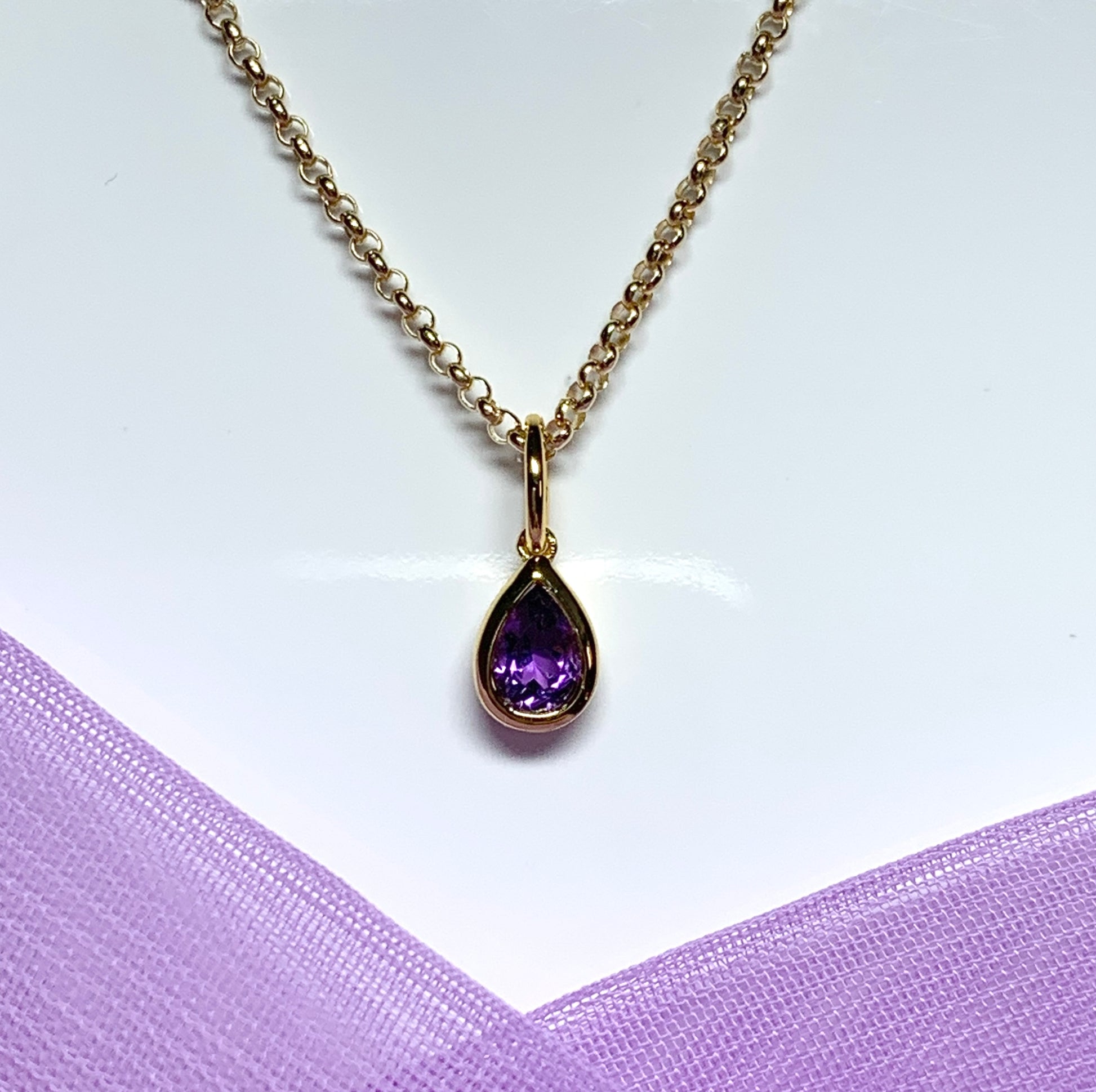 Pear shaped necklace set with a real amethyst stone sterling silver gilt including chain