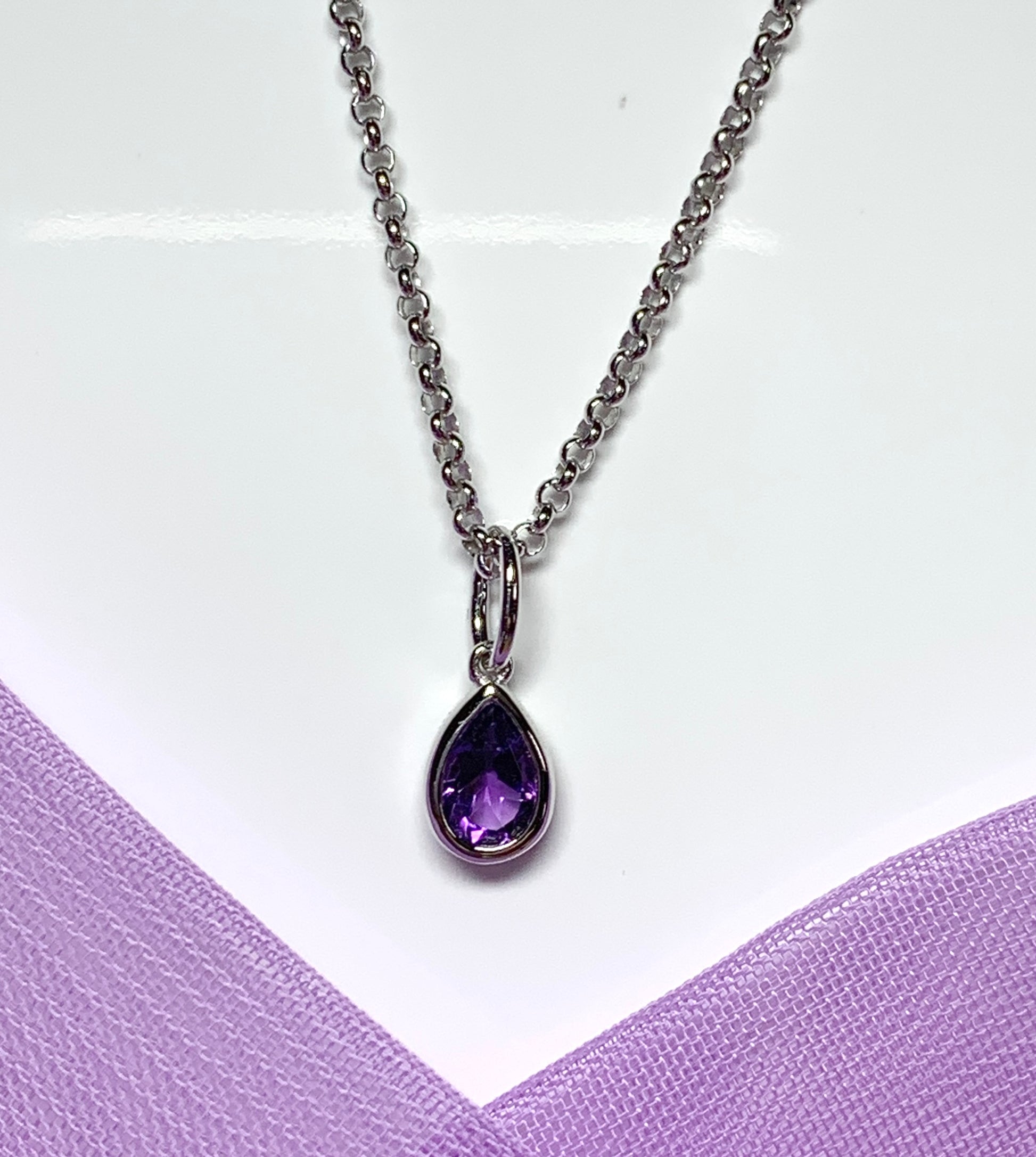 Pear shaped necklace set with a real amethyst stone sterling silver including chain