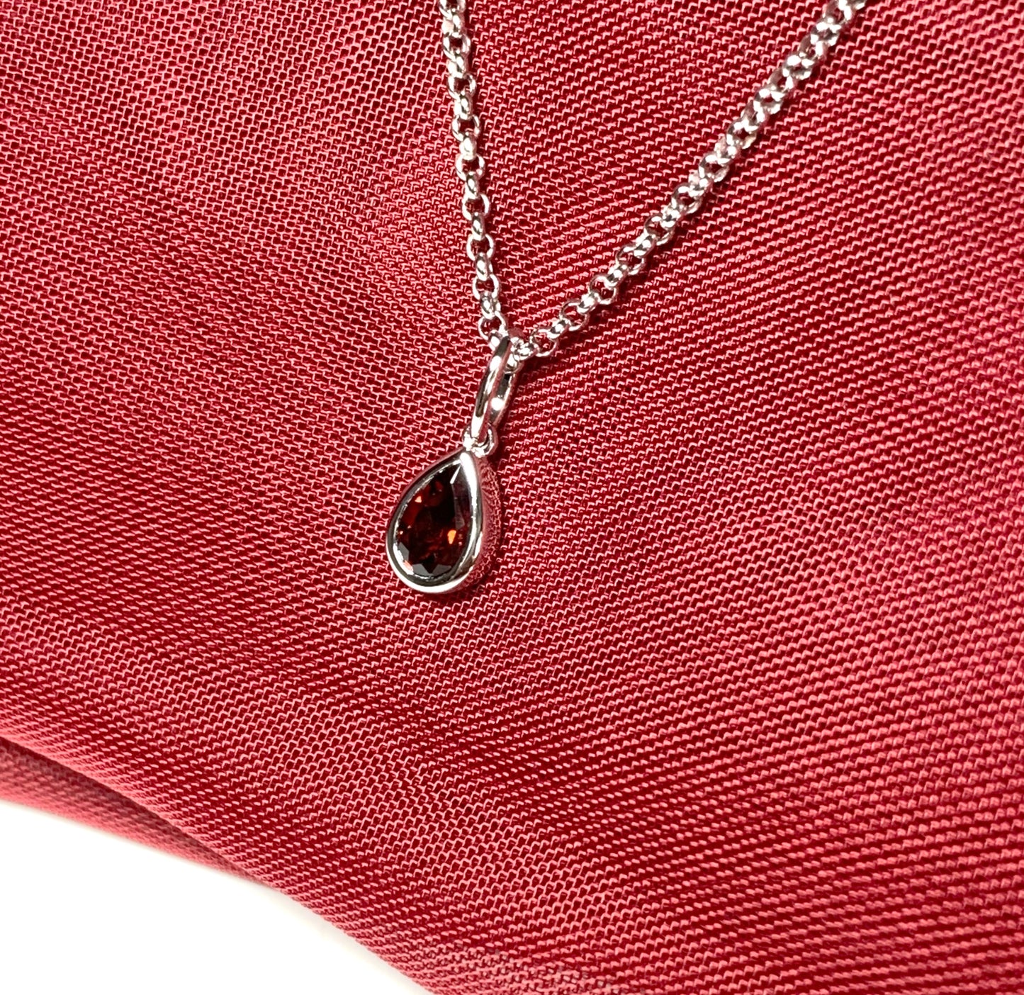 Pear shaped necklace set with a real red garnet stone sterling silver including chain