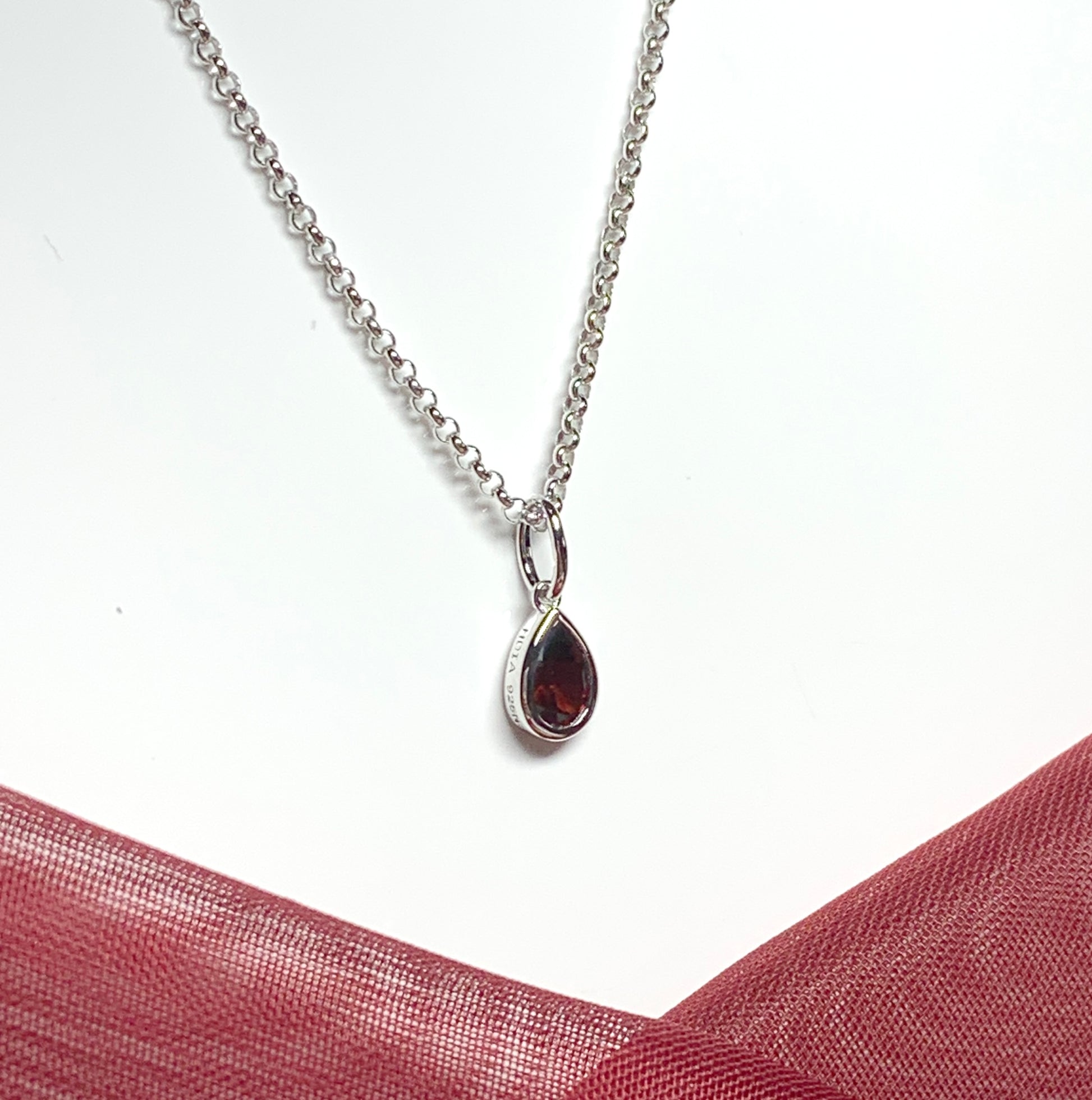 Pear shaped necklace set with a real red garnet stone sterling silver including chain