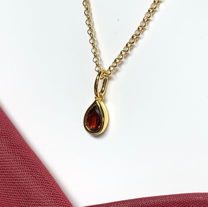 Pear shaped necklace set with a real red garnet stone sterling silver gilt including chain