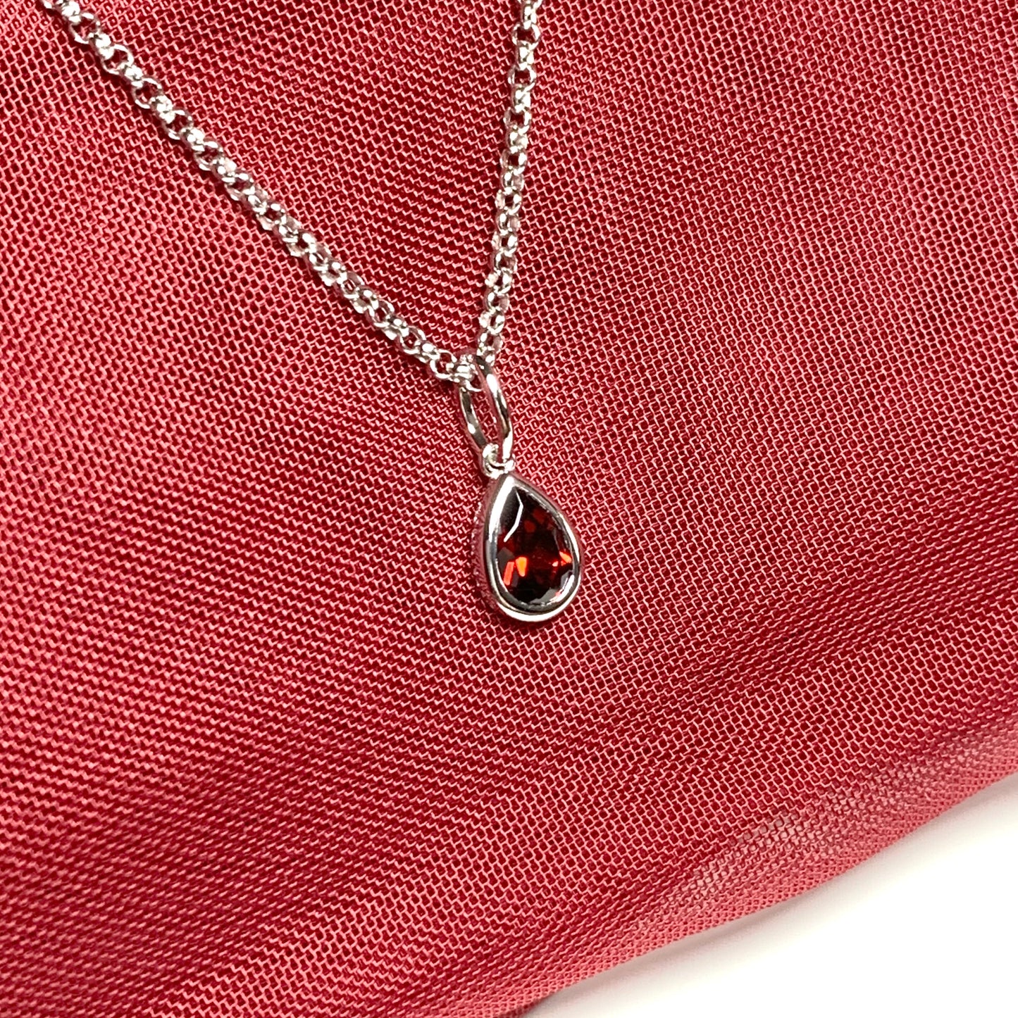 Pear shaped necklace set with a real red garnet stone sterling silver including chain