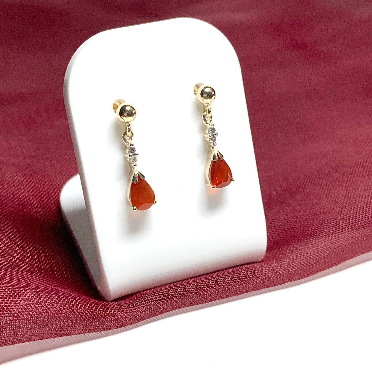 Pear shaped orange real fire opal and diamond drop earrings yellow gold