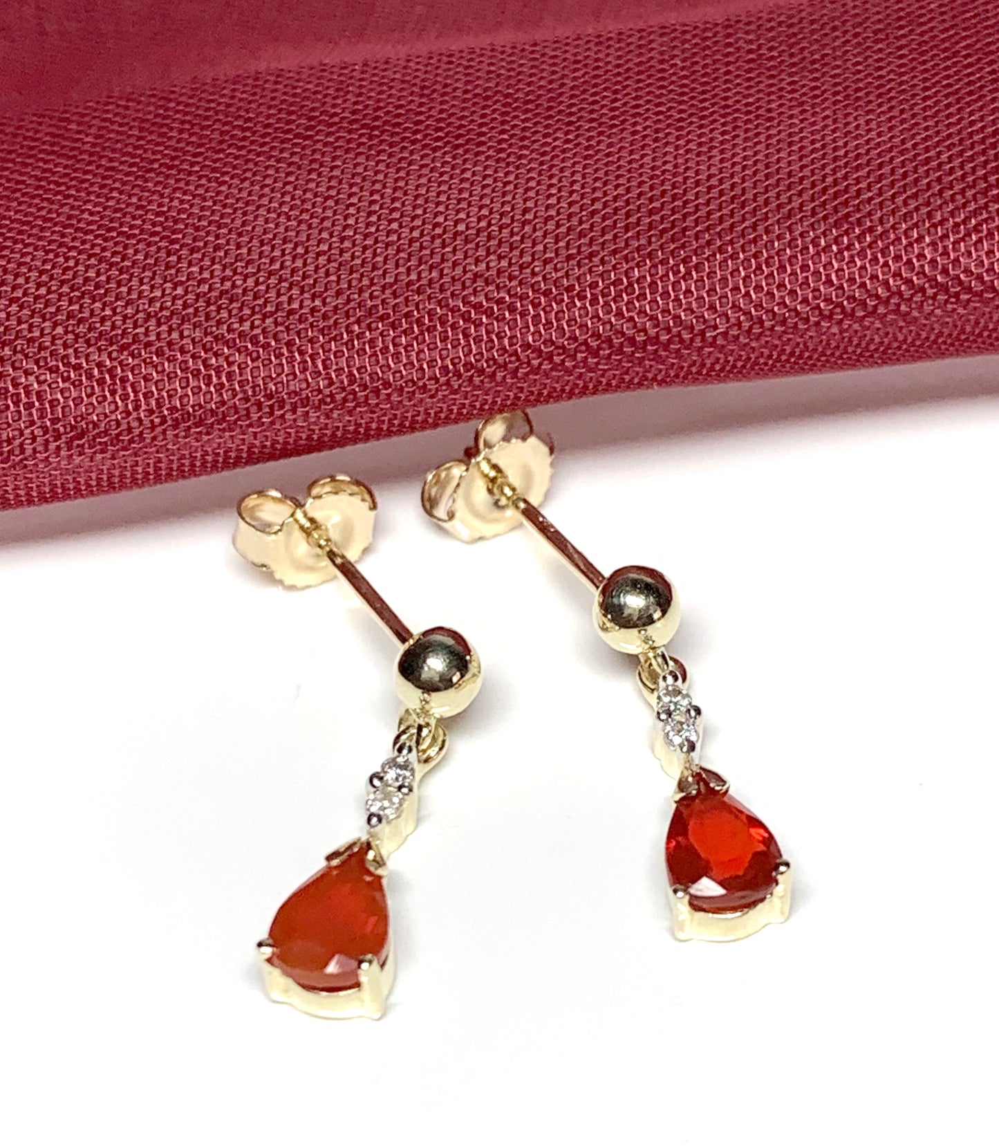 Pear shaped orange real fire opal and diamond drop earrings yellow gold