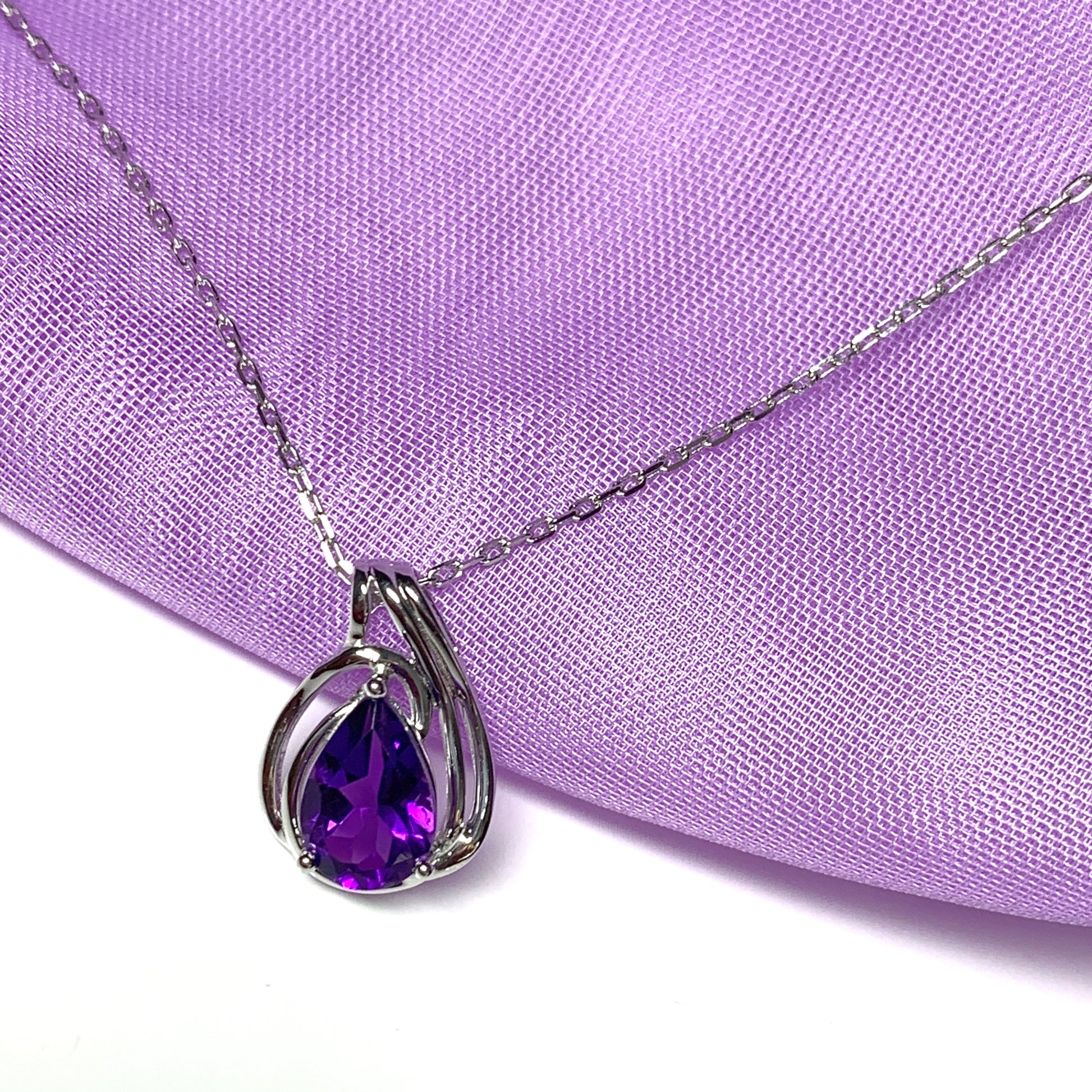 Pear shaped purple amethyst swirl mount white  gold necklace