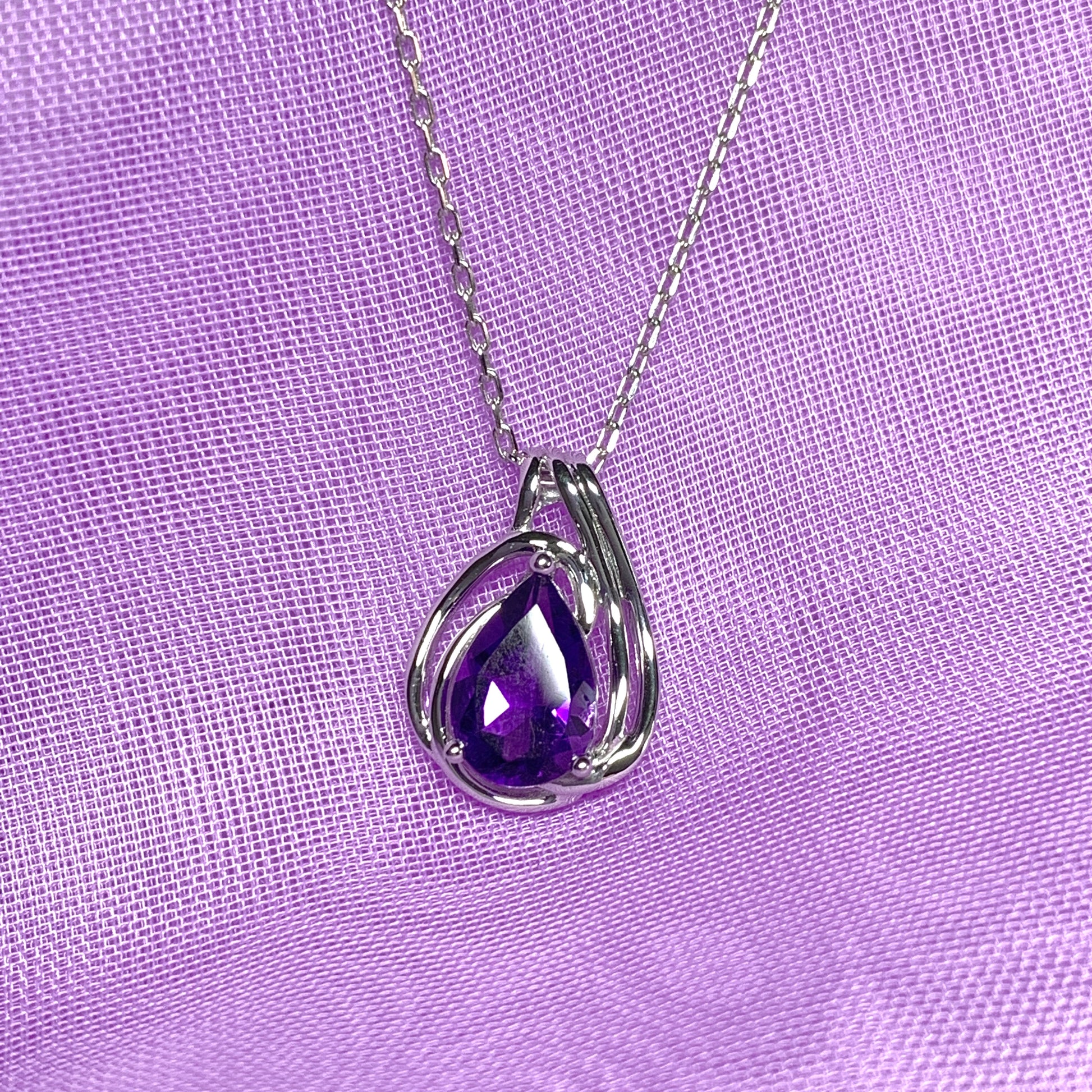 Pear shaped purple amethyst swirl mount white  gold necklace