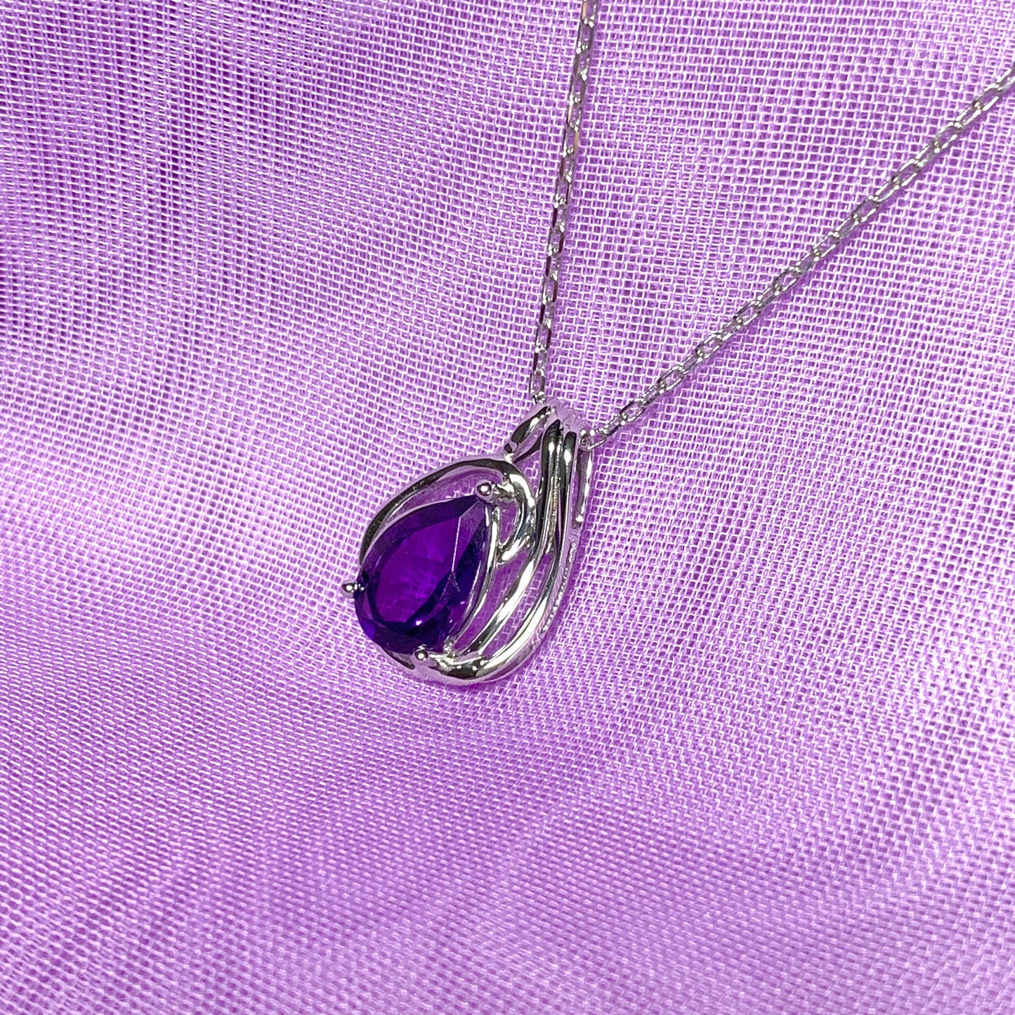 Pear shaped purple amethyst swirl mount white  gold necklace