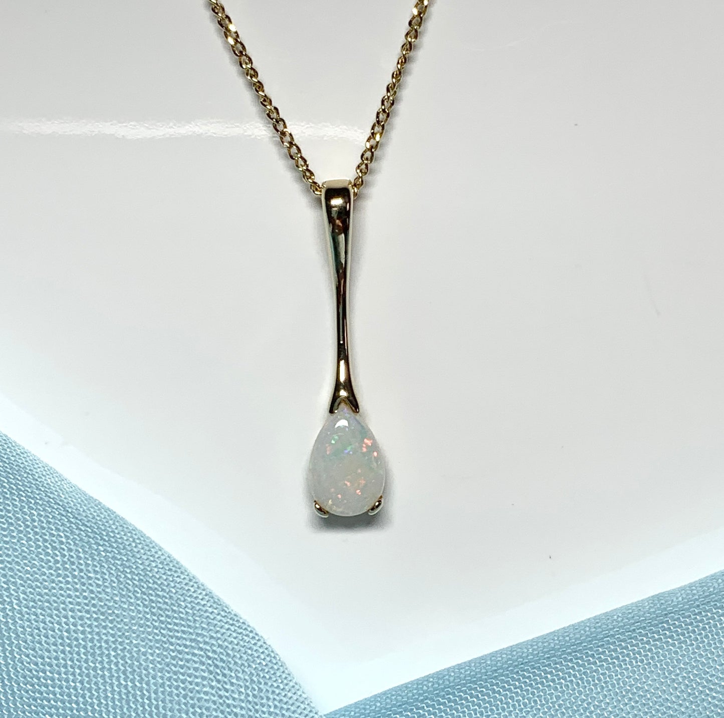 Pear shaped real opal yellow gold long necklace pendant