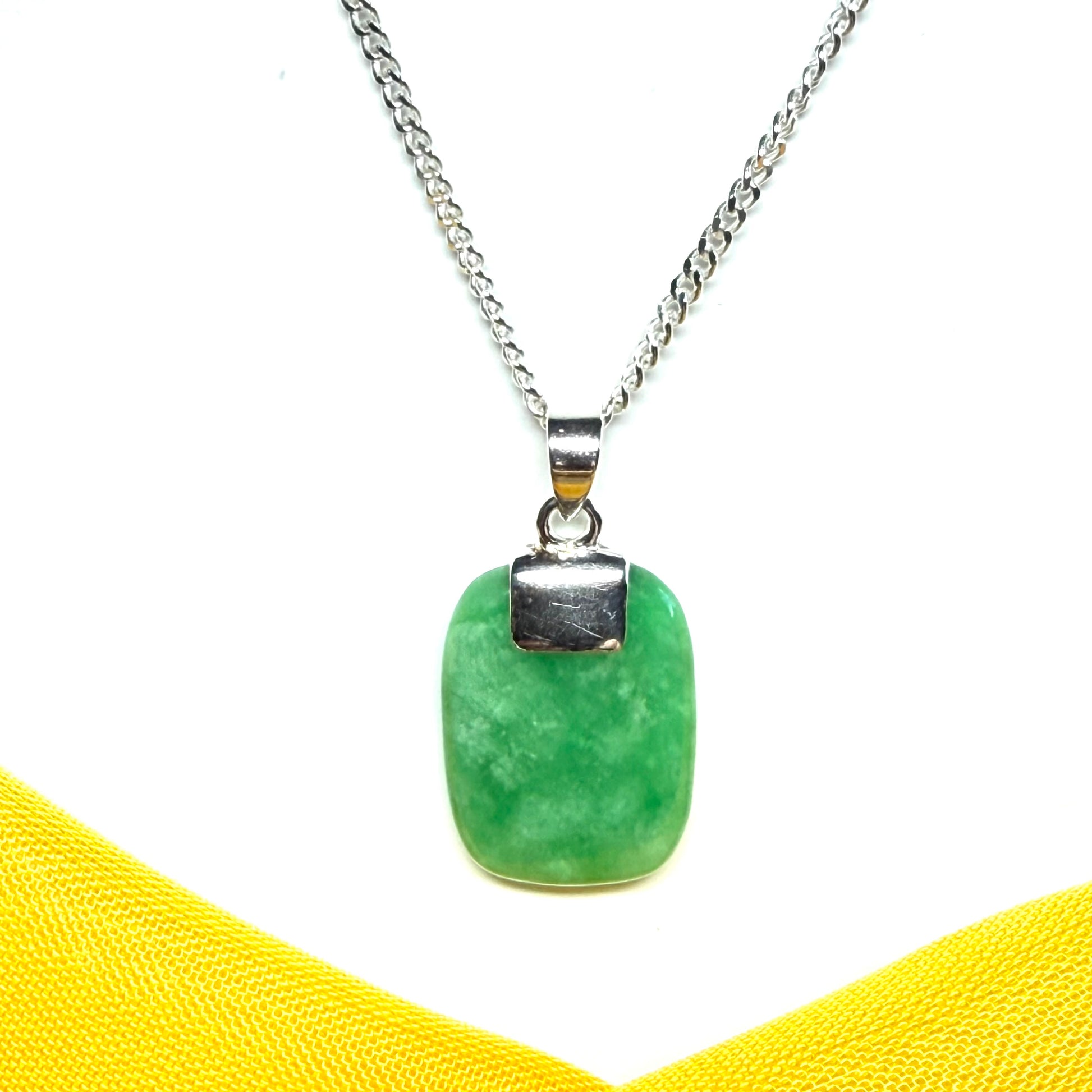 Green pendant necklace on a white background