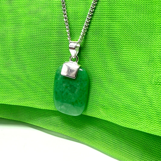Pendant necklace having a real green jade stone sterling silver cushion shape, a timeless design