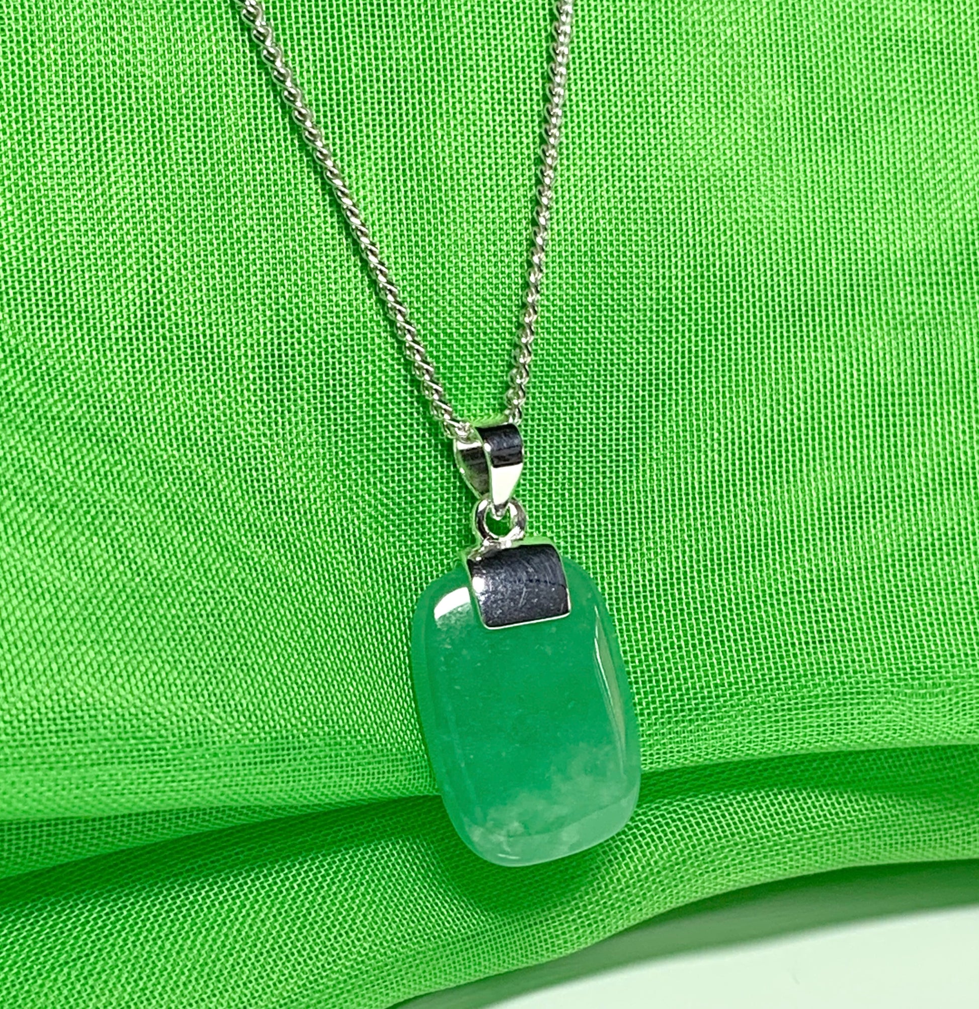 Pendant necklace having a real green jade sterling silver cushion shaped