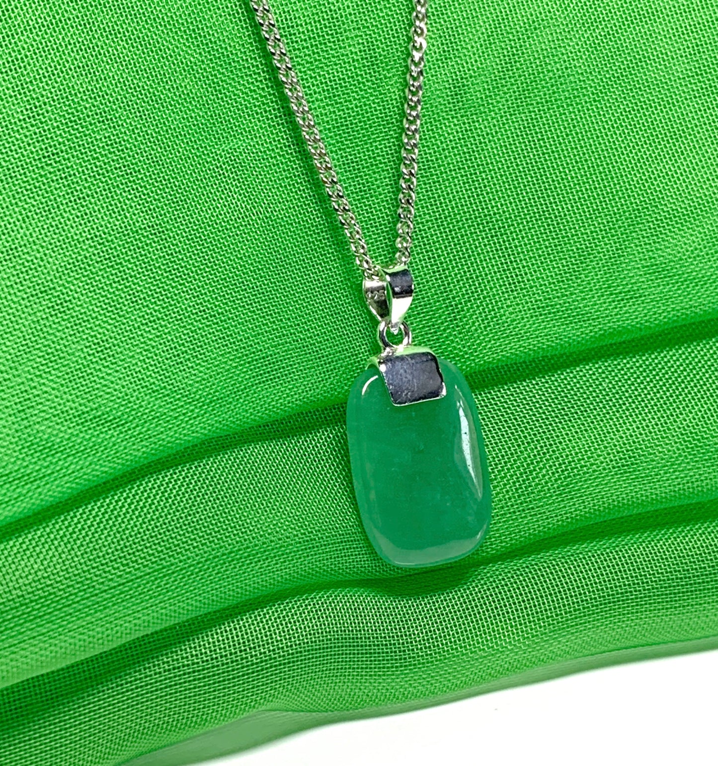 Pendant necklace having a real green jade stone sterling silver cushion shape