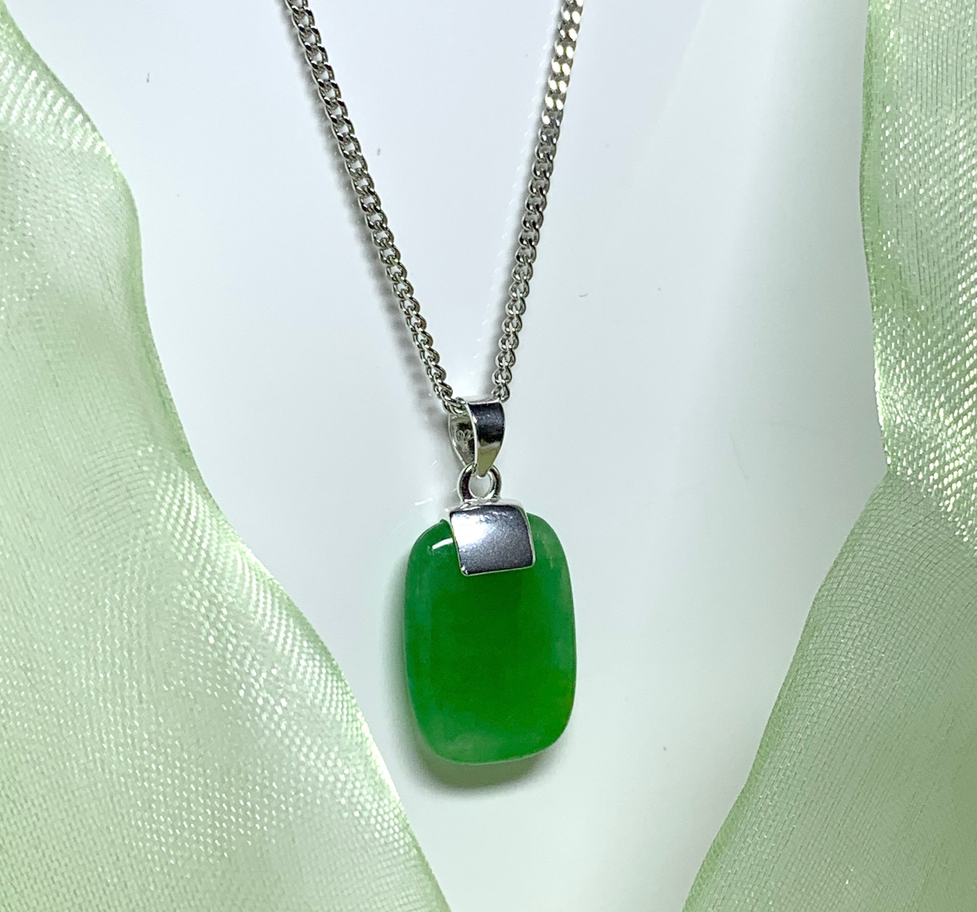 Drop pendant necklace with a real green jade sterling silver cushion shaped