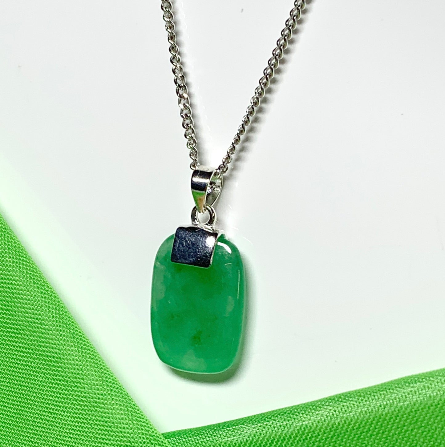 Pendant necklace having a real green jade sterling silver cushion shape