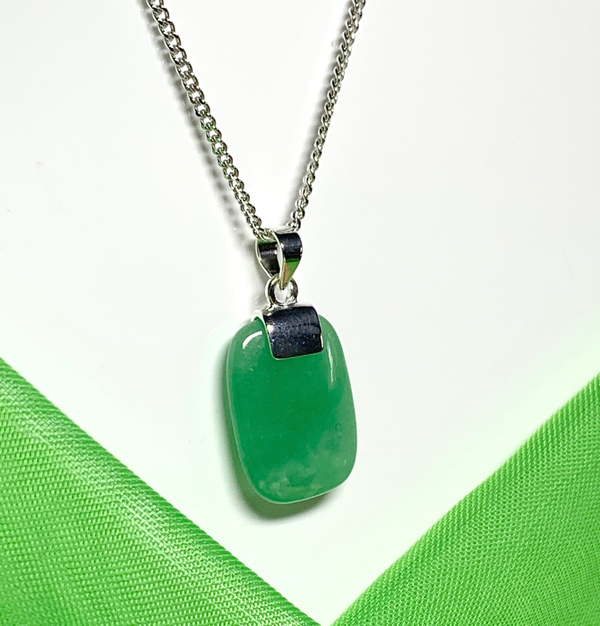 Pendant necklace having a real green jade sterling silver cushion shaped