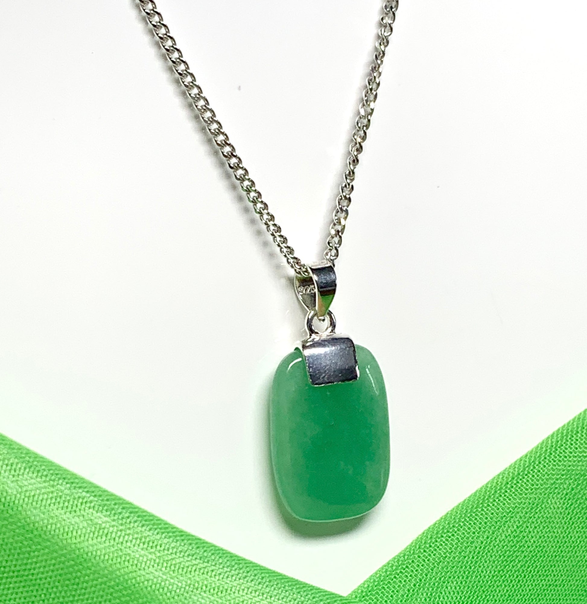 Pendant necklace having a real green jade stone sterling silver cushion shape