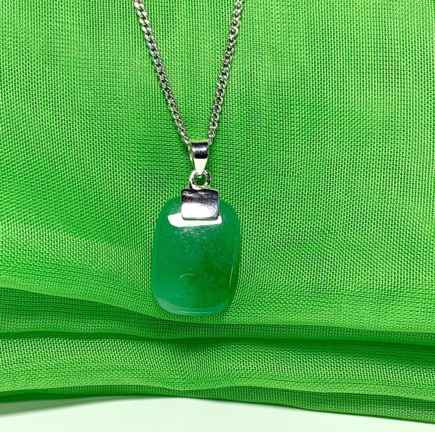 Pendant necklace having a real green jade stone sterling silver cushion shaped