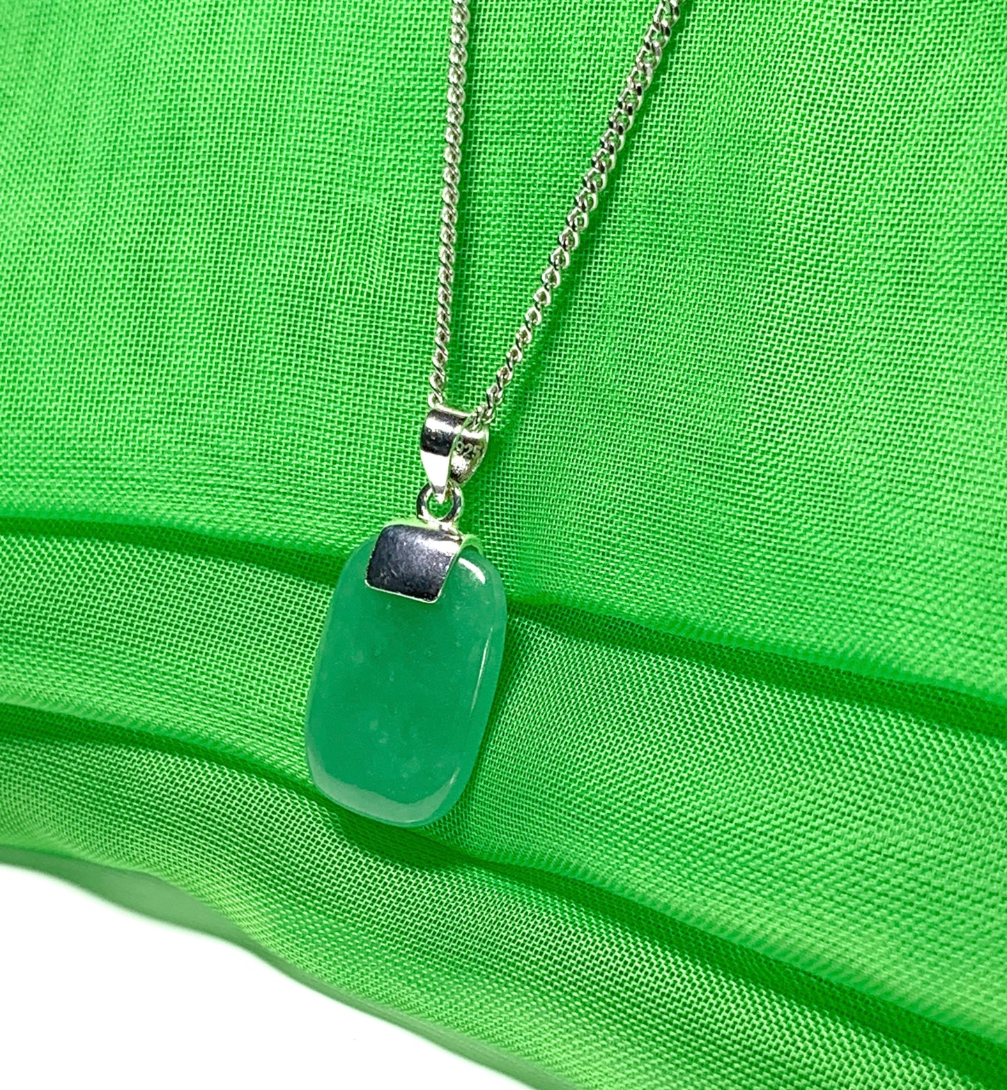 Pendant necklace having a real green jade stone sterling silver cushion shape