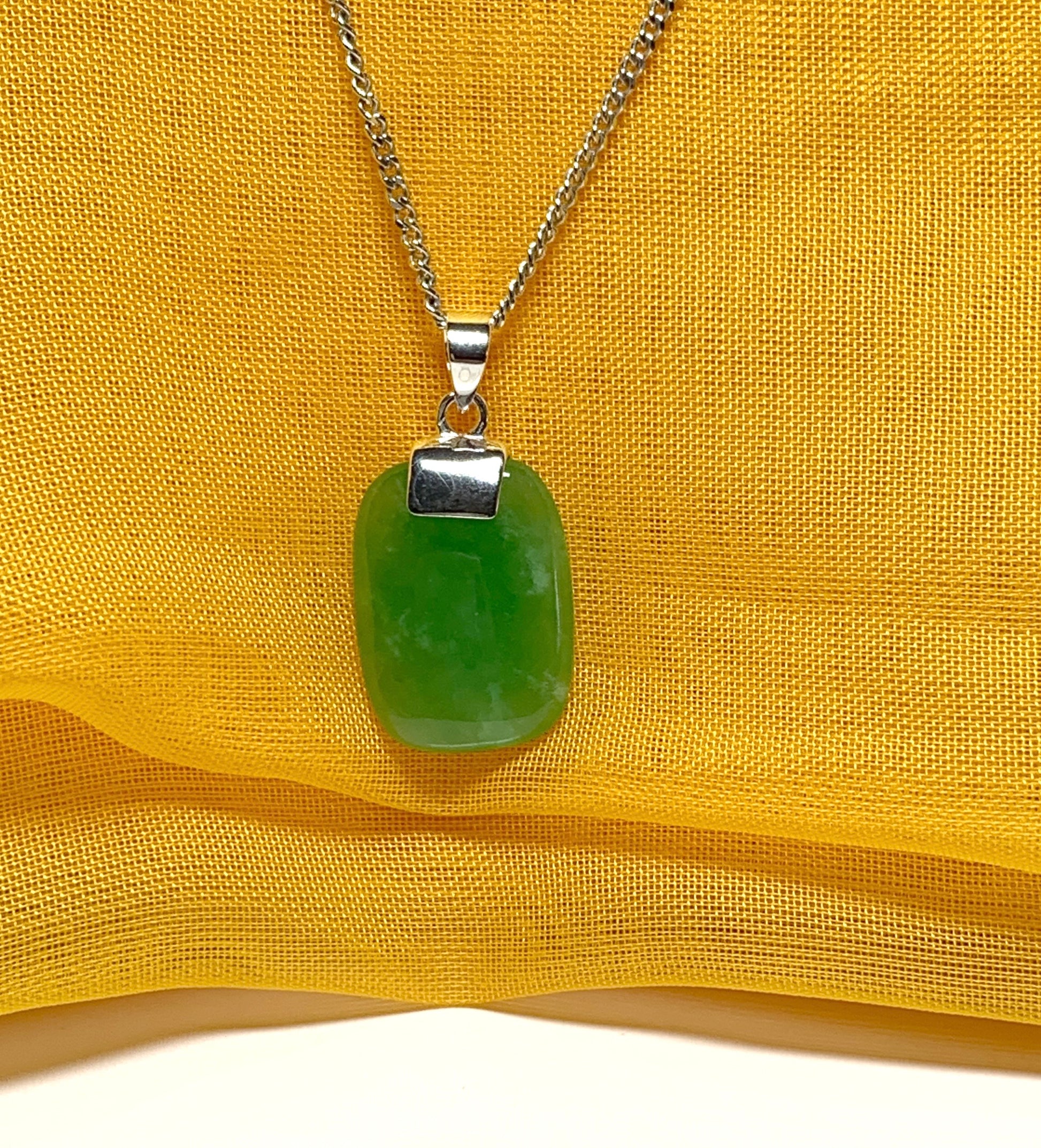 Pendant necklace with a real green lozenge jade stone sterling silver cushion shaped