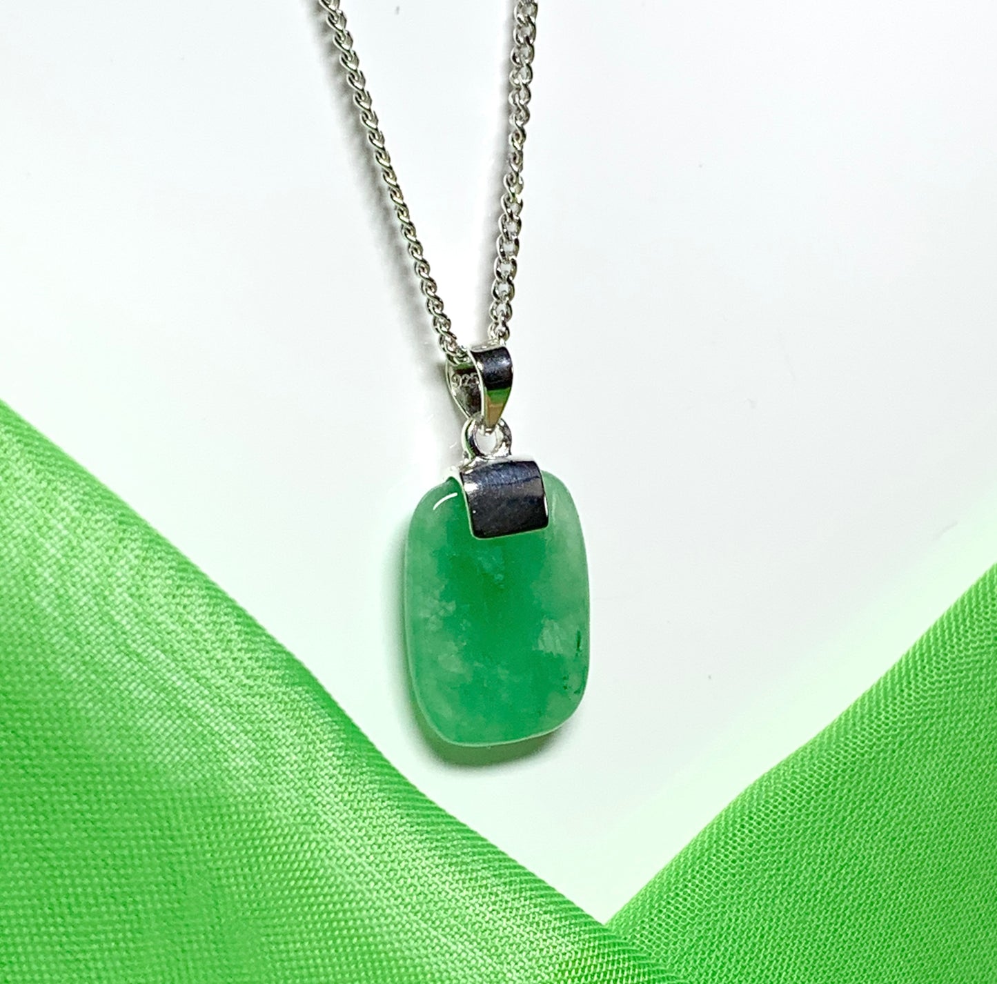 Pendant necklace with a real green jade stone sterling silver cushion shaped