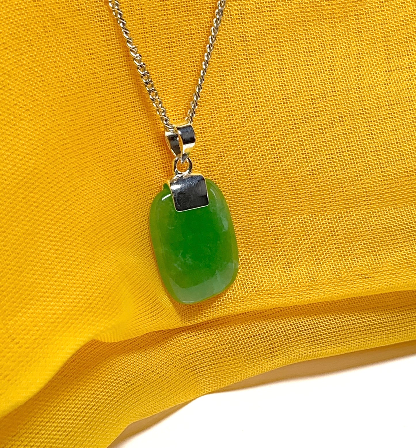 Pendant necklace with a real green lozenge jade stone sterling silver cushion shaped