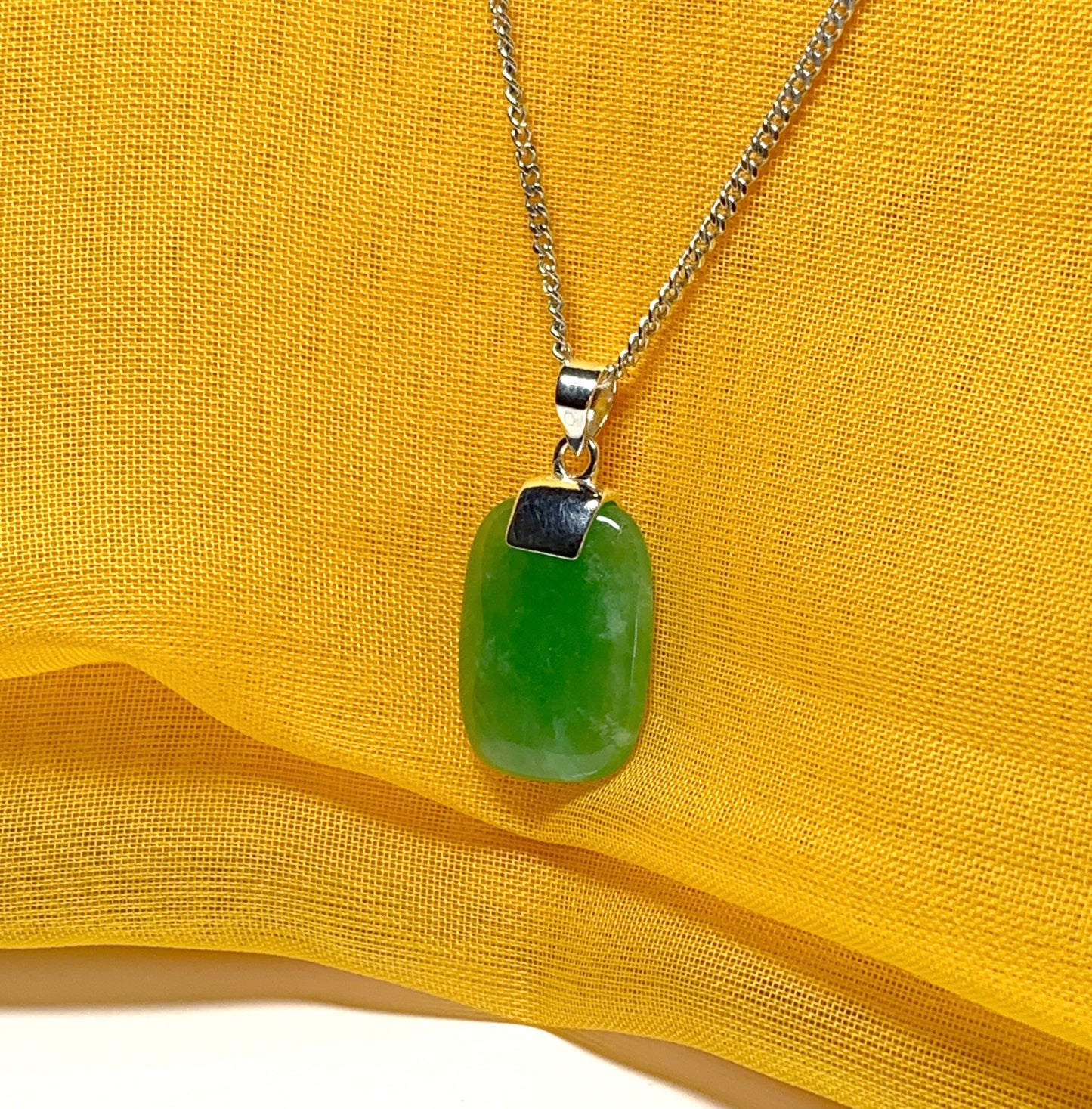 Pendant necklace with a real green lozenge jade stone sterling silver cushion shaped