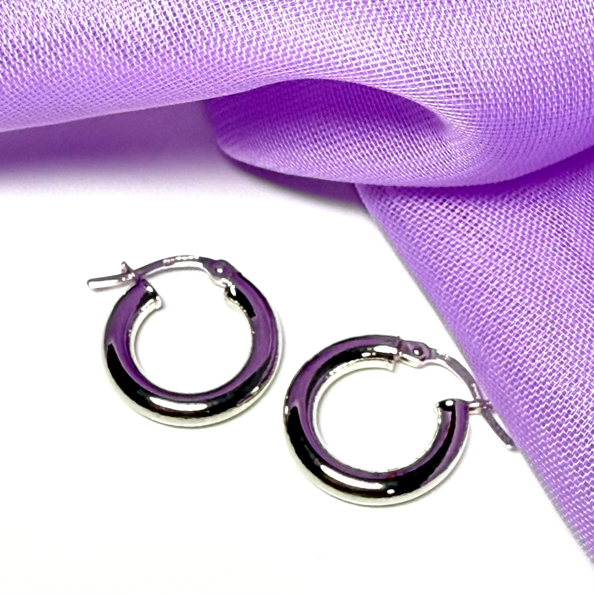 Plain highly polished white gold hoop earrings 16 mm