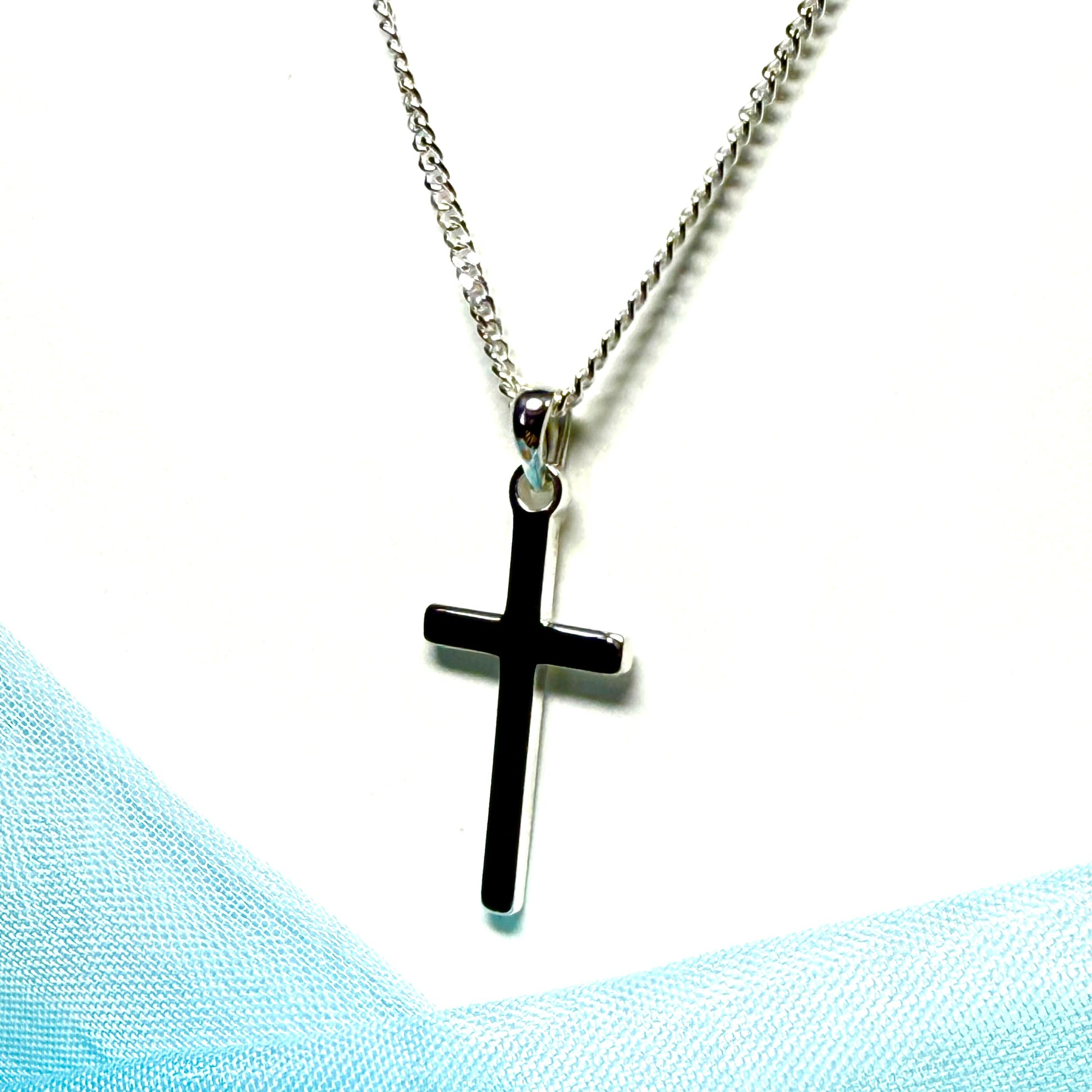 Polished plain solid sterling silver cross including a curb chain
