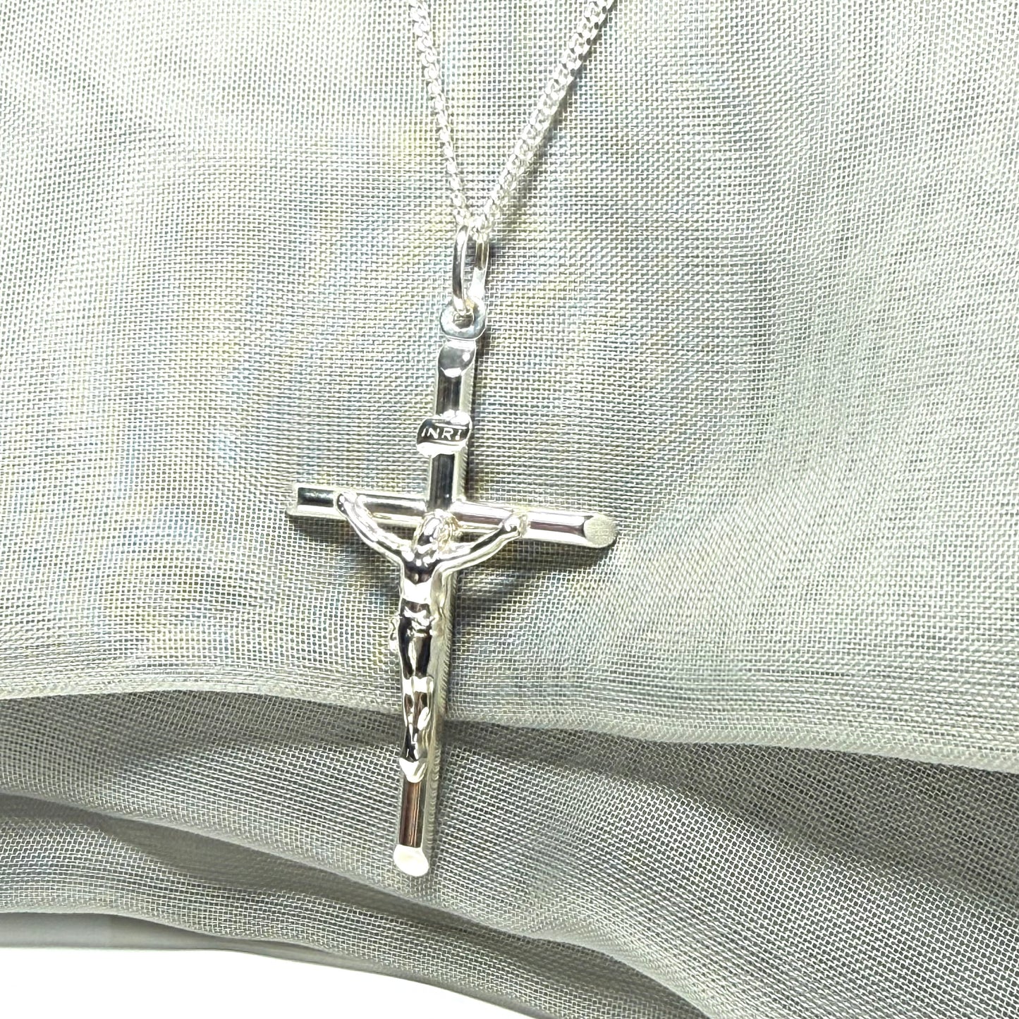 Polished sterling silver crucifix cross necklace including chain