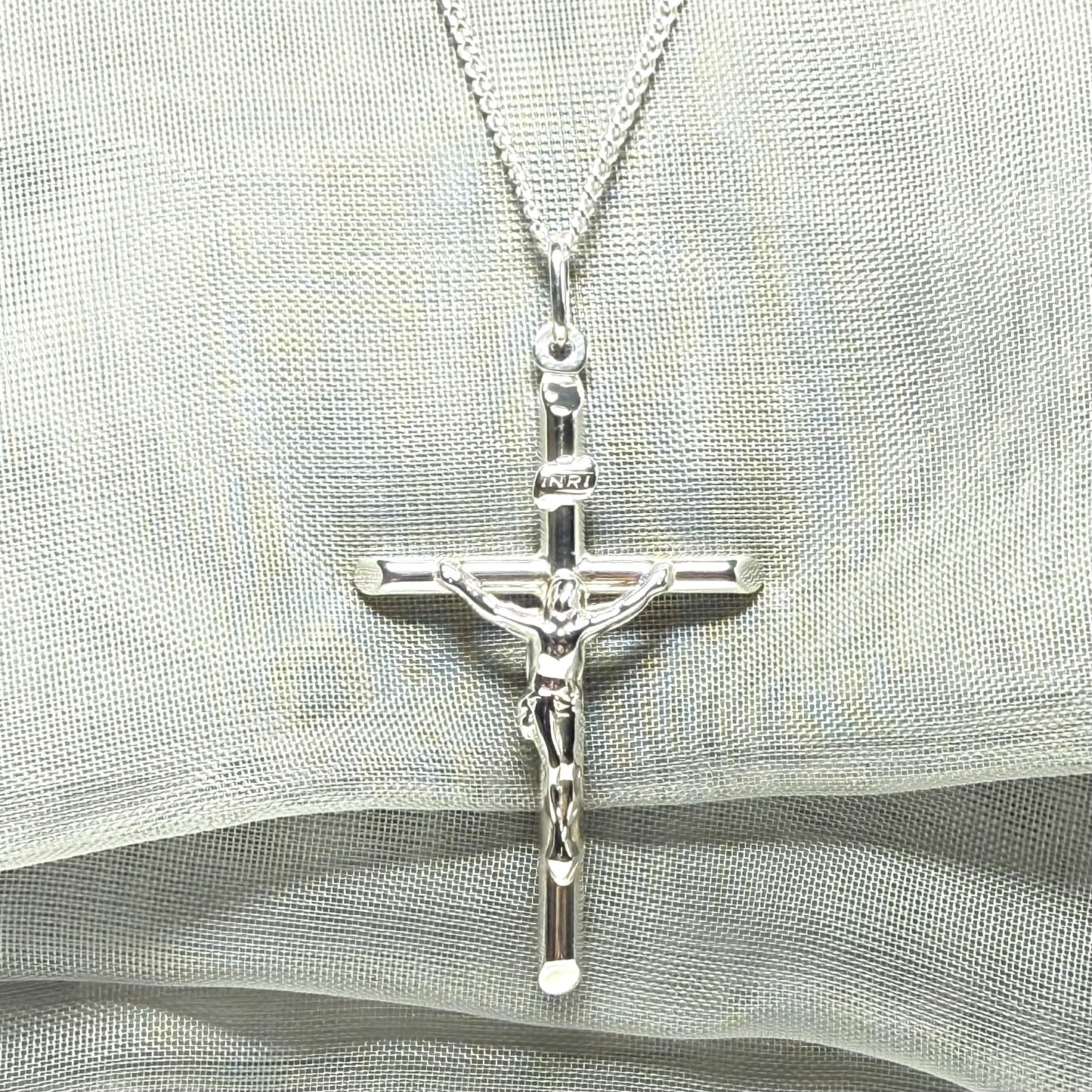 Polished sterling silver crucifix cross necklace including chain