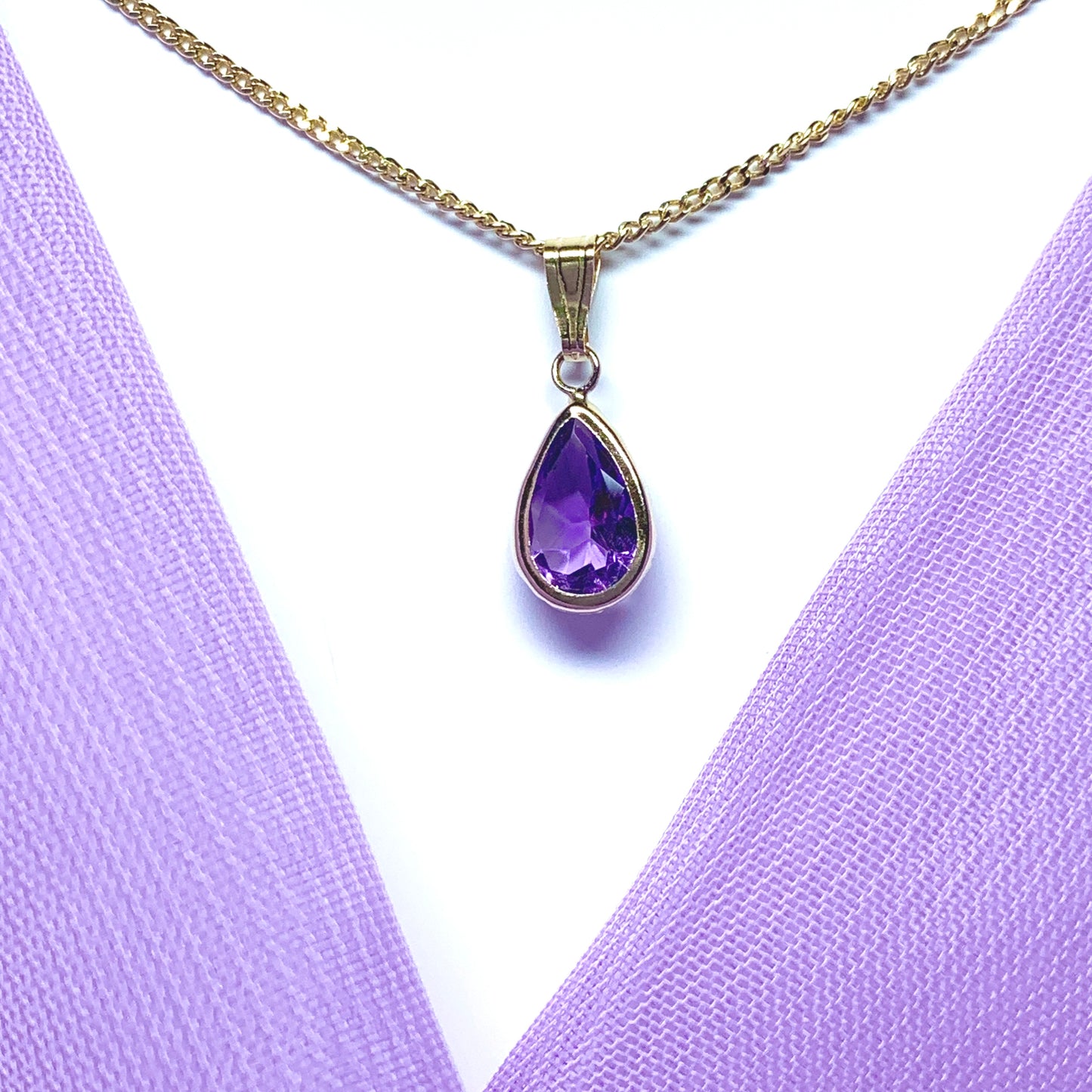 Purple amethyst pear shaped yellow gold necklace