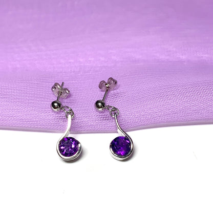 Purple amethyst white gold round drop swirl earrings