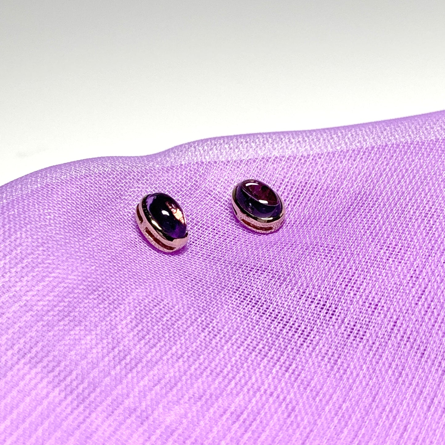 Purple oval amethyst yellow gold earrings