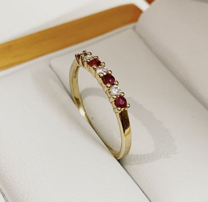 Real red ruby and diamond claw set eternity ring yellow gold