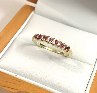 Red ruby eternity ring yellow gold