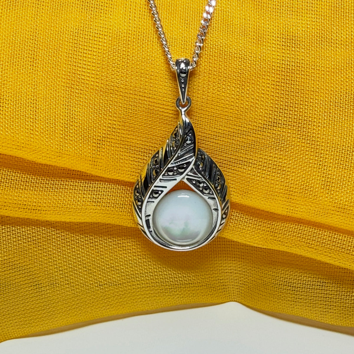 Real Mother of Pearl and marcasite sterling silver necklace round stone