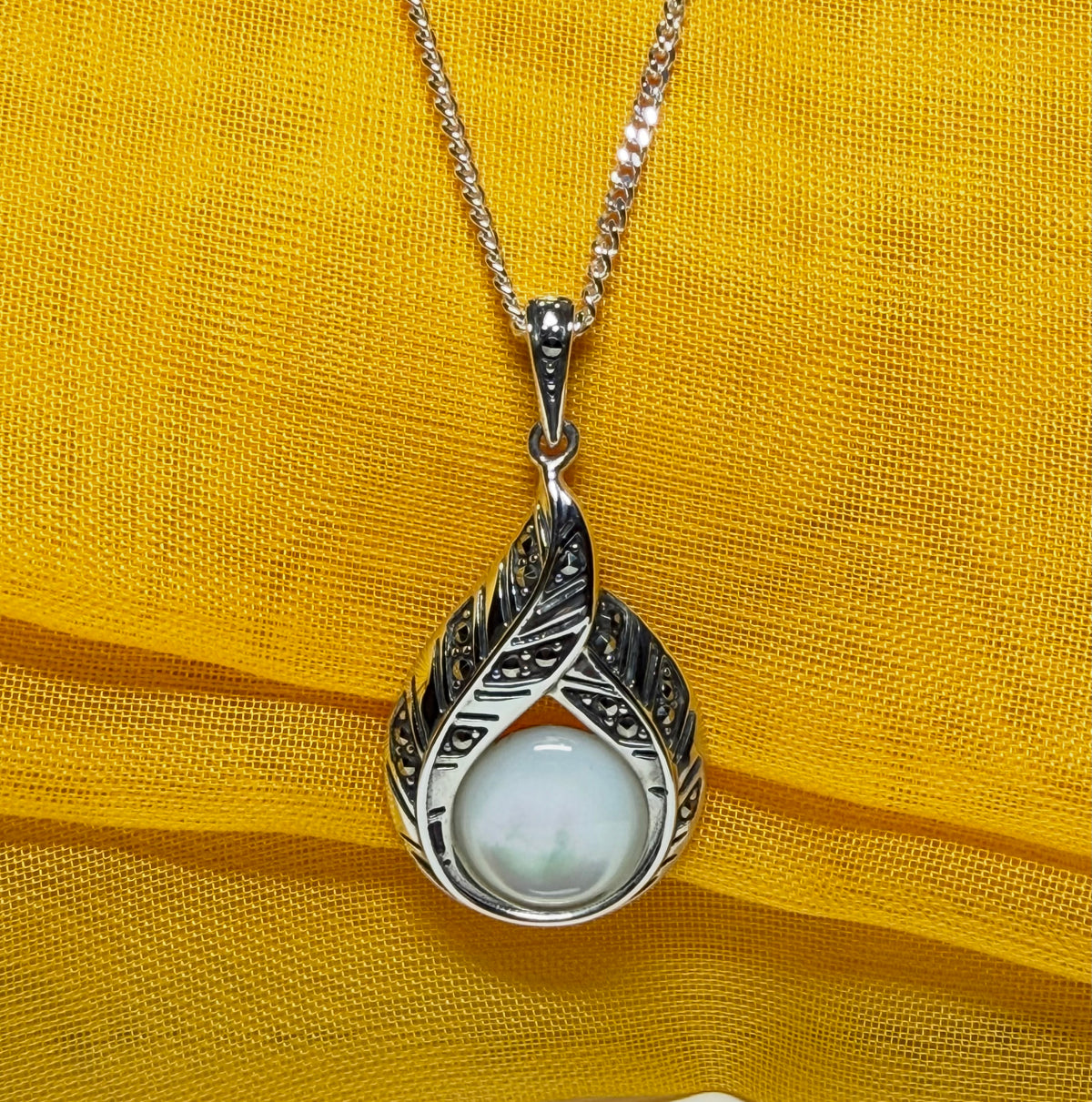 Real Mother of Pearl and marcasite sterling silver necklace round stone