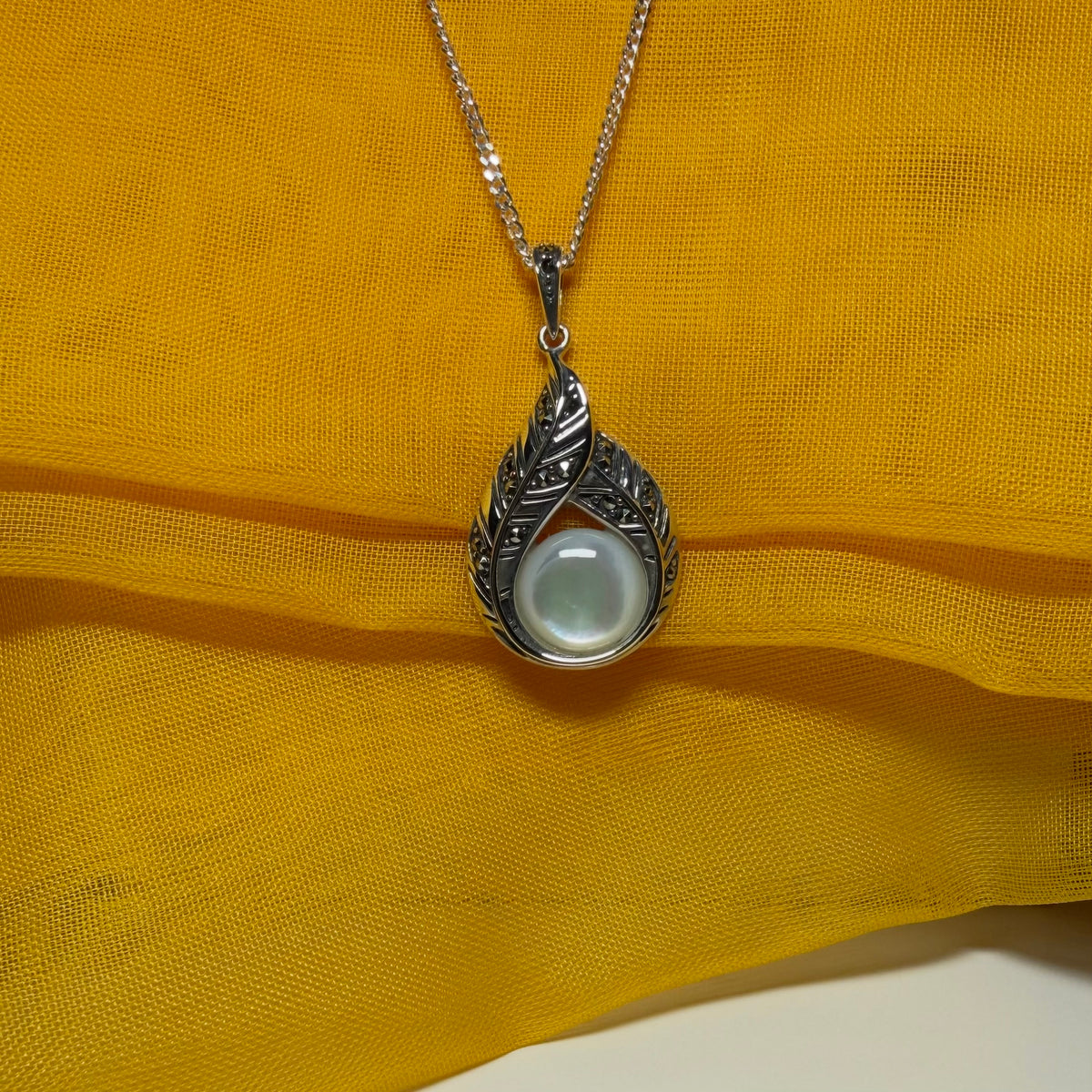 Real Mother of Pearl and marcasite sterling silver necklace round stone with a chain
