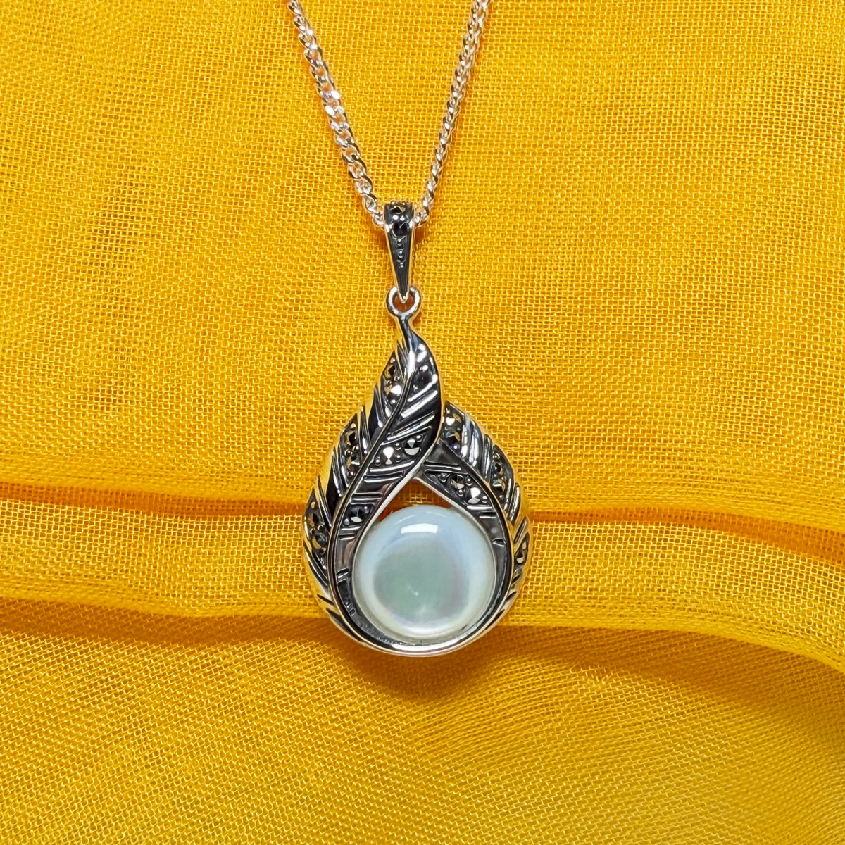 Real Mother of Pearl and marcasite sterling silver necklace round stone