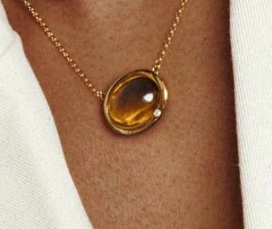 Real Tiger Eye oval shaped necklace sterling silver gold plated on the neck