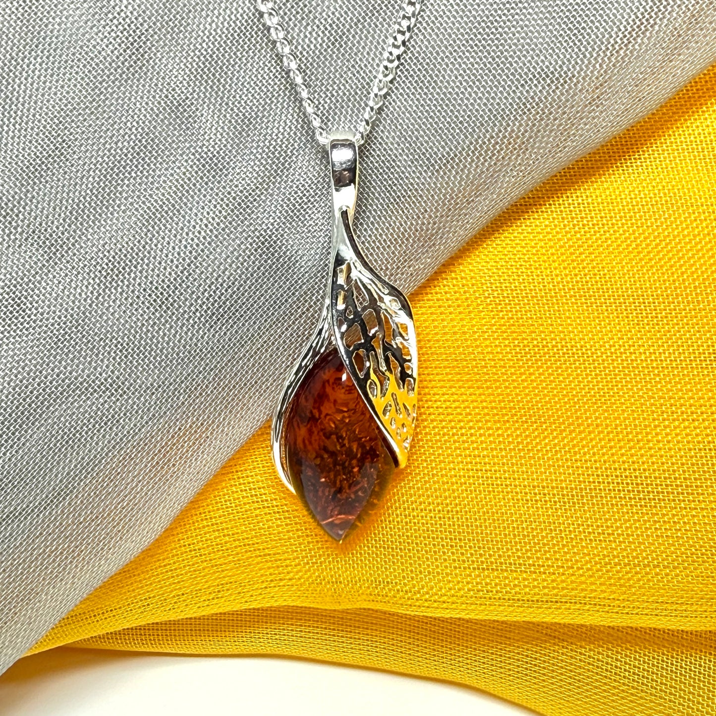 Real amber marquise sterling silver necklace with a swirl set fancy open pendant with chain