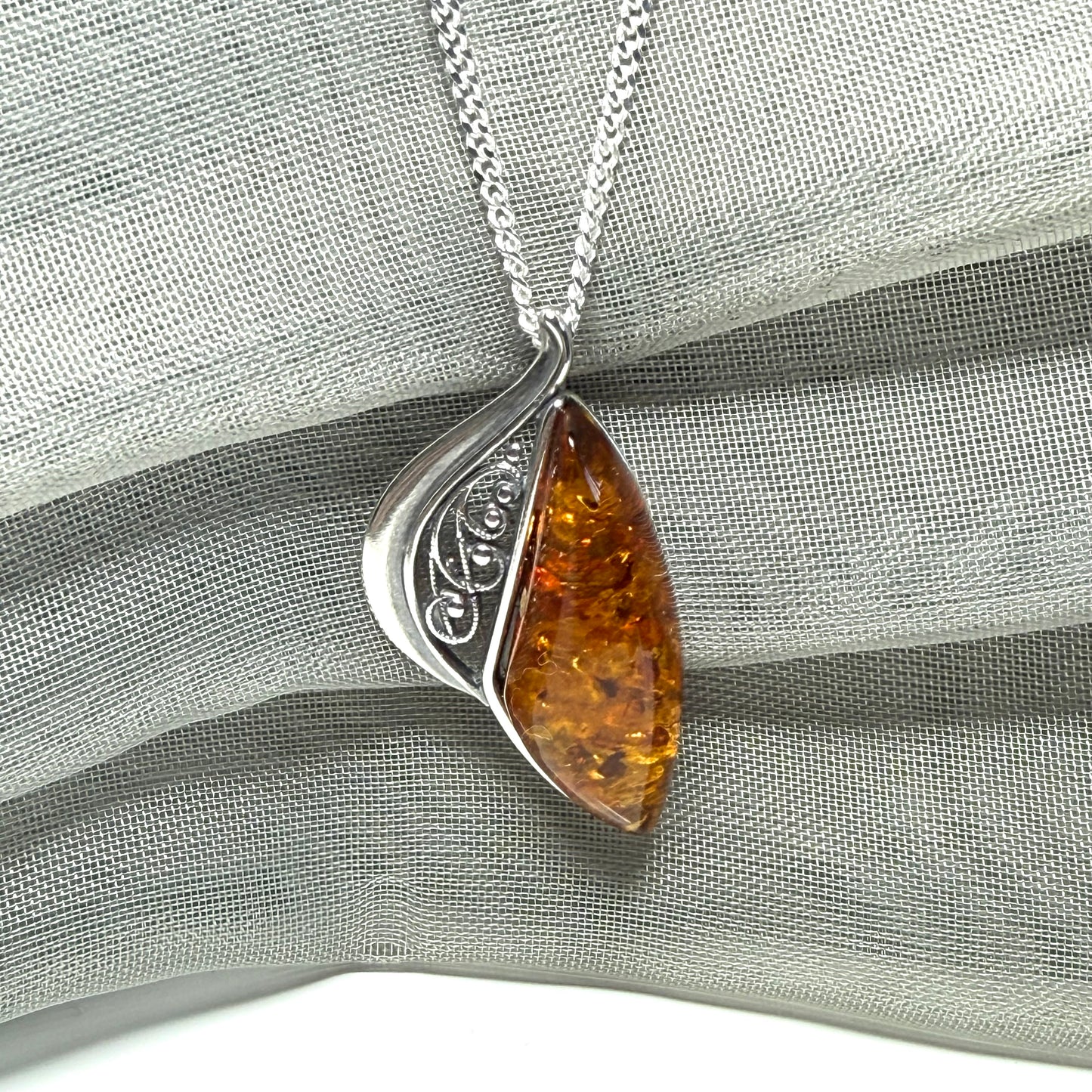 Real amber necklace sterling silver fancy half open pierced pendant design