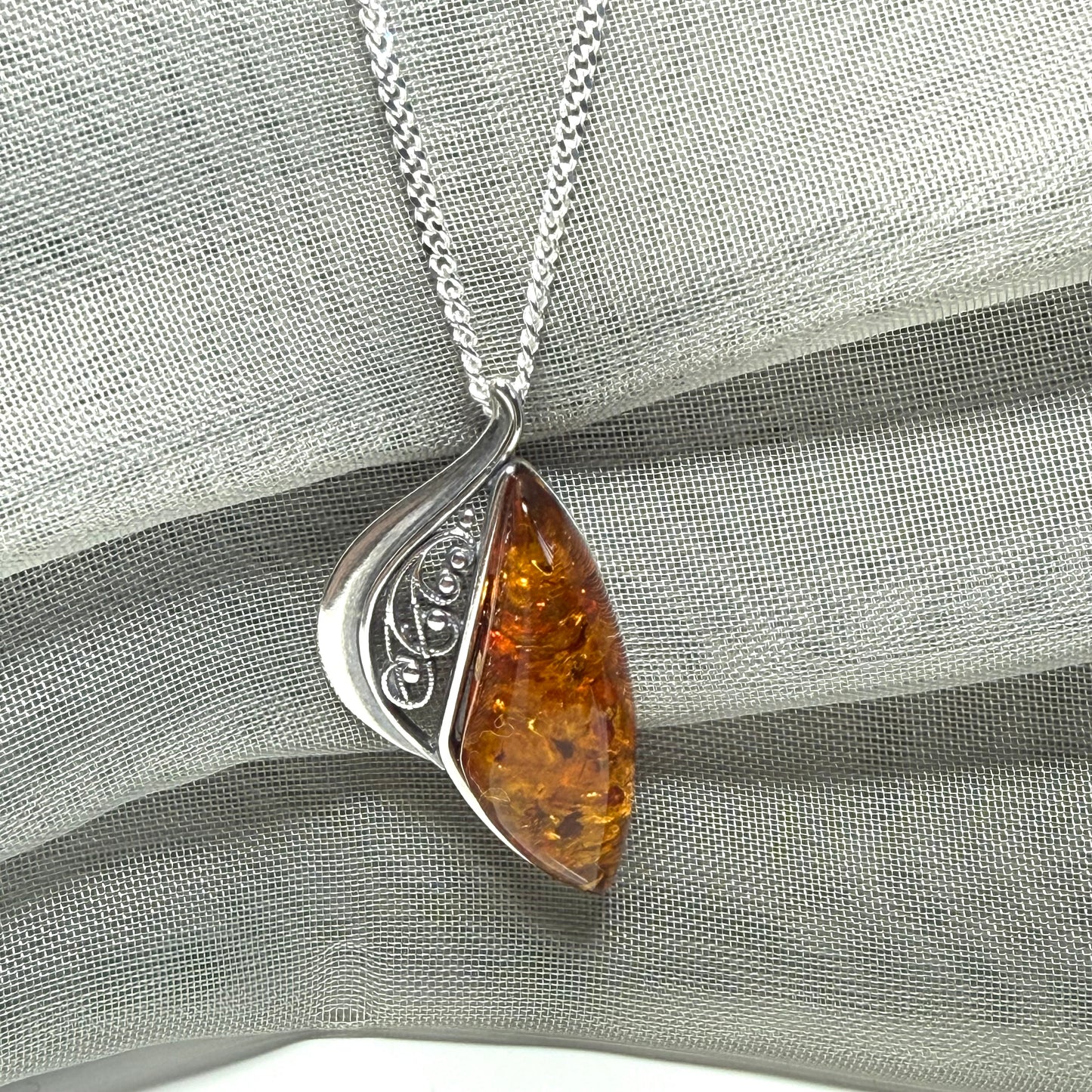 Real amber necklace sterling silver fancy half open pierced pendant design