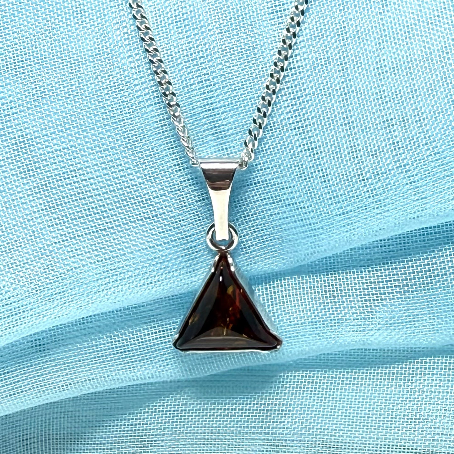 A real amber necklace sterling silver triangle shape dark amber pendant