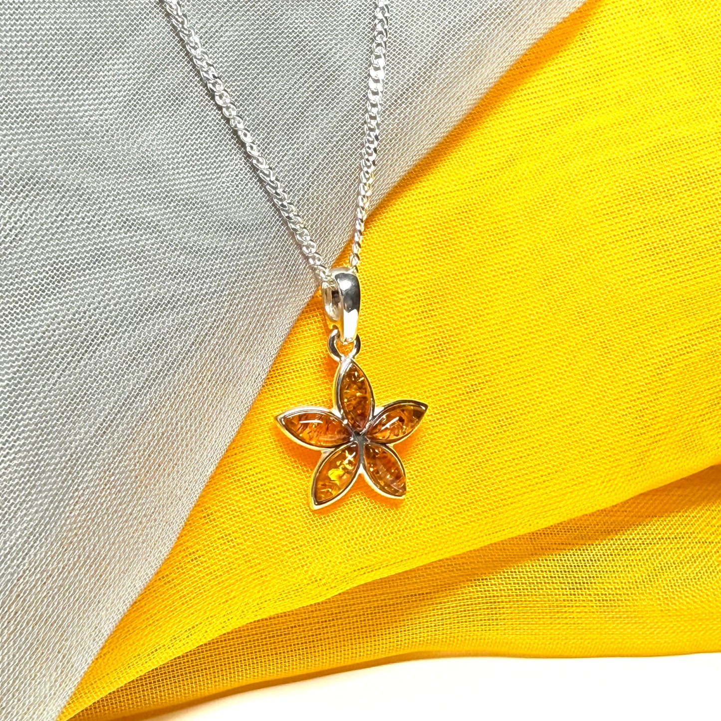 Real amber star shaped necklace sterling silver pendant