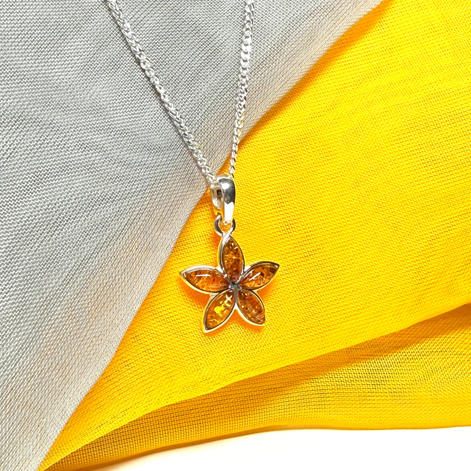 Real amber star shaped necklace sterling silver pendant
