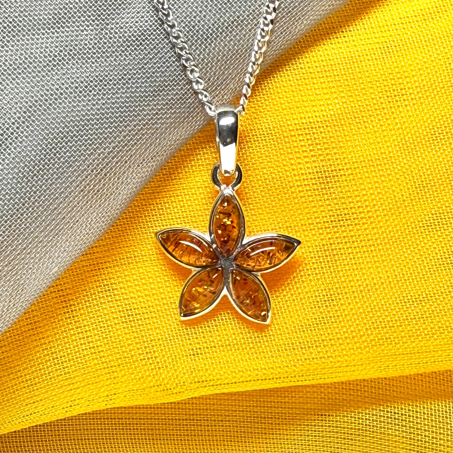 Real amber star shaped necklace sterling silver pendant