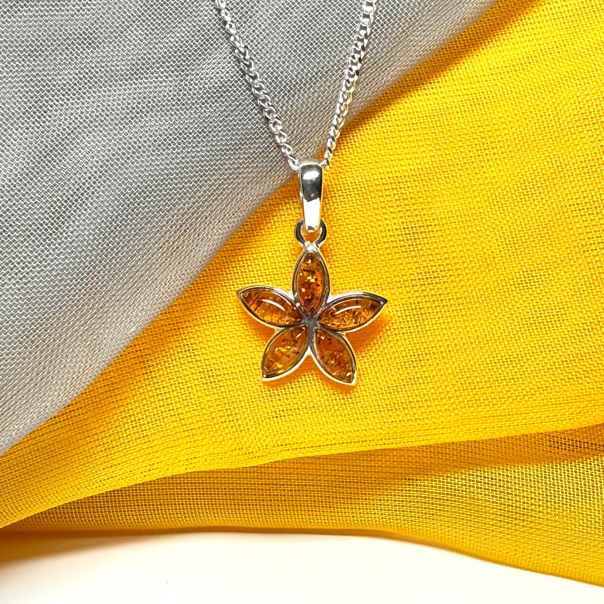 Real amber star shaped necklace sterling silver pendant