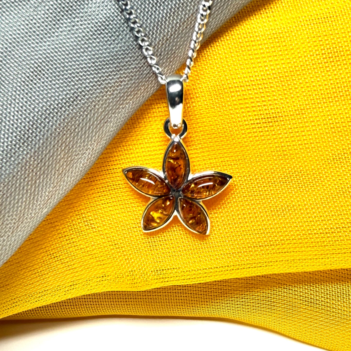 Real amber star shaped necklace sterling silver pendant